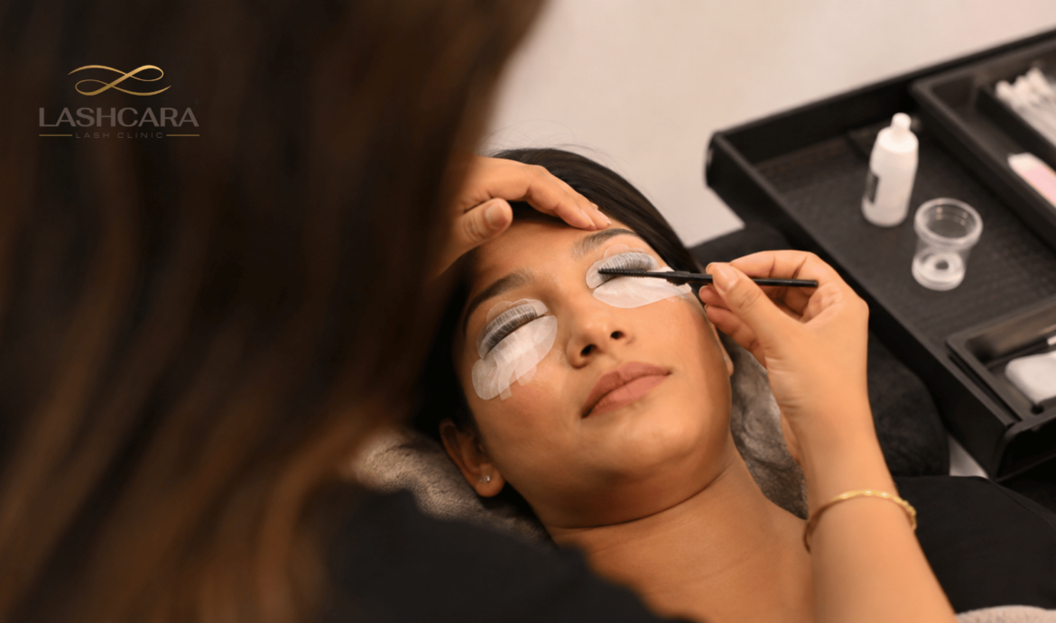Lash artist performing a professional lash lift on an Indian client using silicone shields at Lashcara Lash Clinic in Pune.