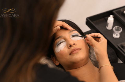 Lash artist performing a professional lash lift on an Indian client using silicone shields at Lashcara Lash Clinic in Pune.